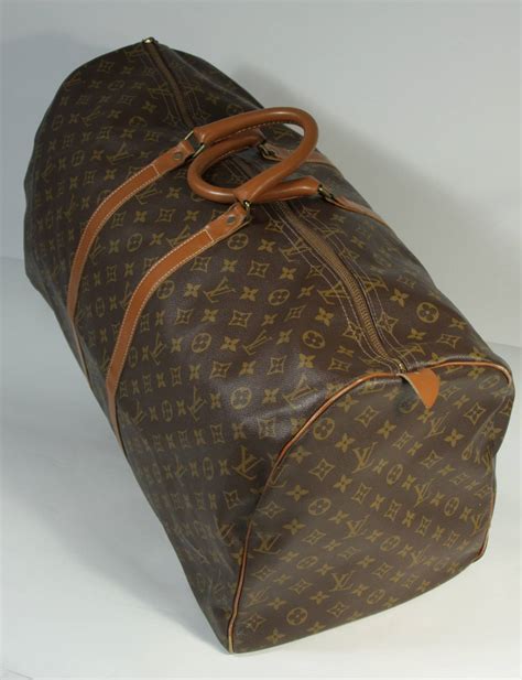 louis vuitton small duffle bag with orange chain|Louis Vuitton duffle bag suitcase.